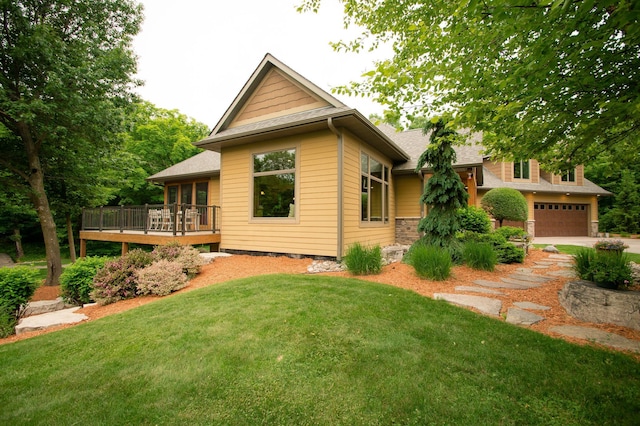 8271 Barton Ave NW, Buffalo, MN 55313 - view of property exterior with a deck, a garage, a lawn, concrete driveway, and roof with shingles