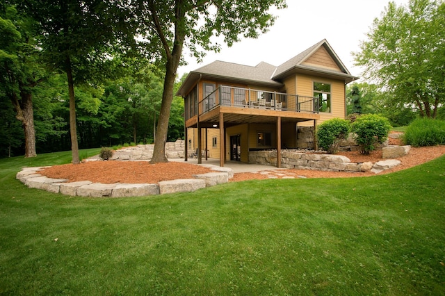 8271 Barton Ave NW, Buffalo, MN 55313 - back of house with a yard, a wooden deck, a patio, and stone siding