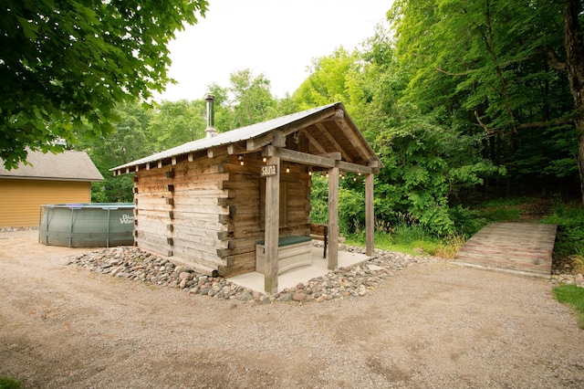 8271 Barton Ave NW, Buffalo, MN 55313 - view of outdoor structure with an outdoor pool