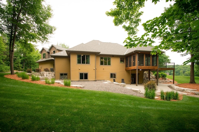 8271 Barton Ave NW, Buffalo, MN 55313 - back of house with a sunroom, a patio, and a yard