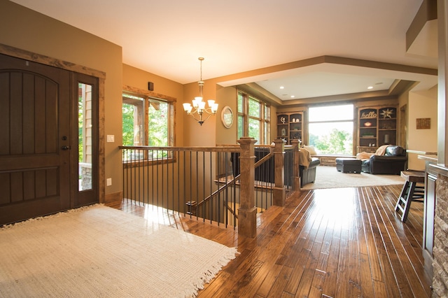 8271 Barton Ave NW, Buffalo, MN 55313 - entrance foyer with a chandelier and wood-type flooring