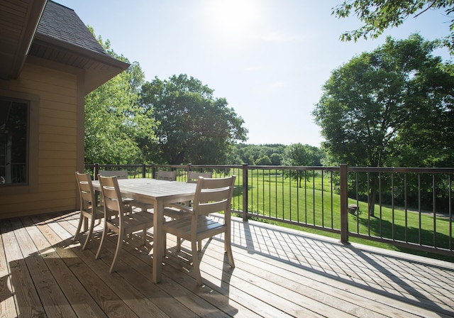 8271 Barton Ave NW, Buffalo, MN 55313 - wooden terrace featuring outdoor dining space and a lawn