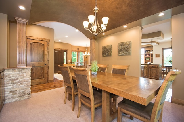 8271 Barton Ave NW, Buffalo, MN 55313 - dining area featuring a chandelier, plenty of natural light, recessed lighting, light colored carpet, and arched walkways