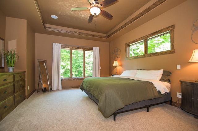 8271 Barton Ave NW, Buffalo, MN 55313 - carpeted bedroom featuring a tray ceiling and a ceiling fan