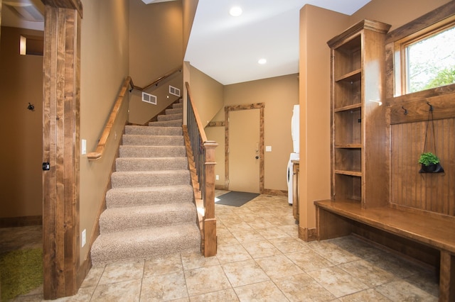 8271 Barton Ave NW, Buffalo, MN 55313 - mudroom featuring recessed lighting and stacked washer / dryer