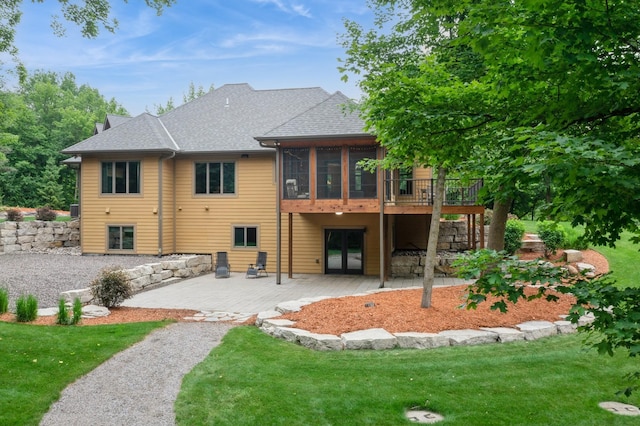8271 Barton Ave NW, Buffalo, MN 55313 - rear view of property featuring a patio area, a sunroom, a yard, and a shingled roof