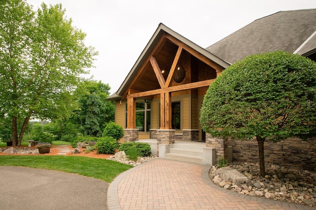 8271 Barton Ave NW, Buffalo, MN 55313 - property entrance with stone siding and a porch