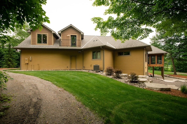 8271 Barton Ave NW, Buffalo, MN 55313 - rear view of house with a lawn and roof with shingles