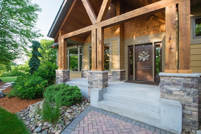 8271 Barton Ave NW, Buffalo, MN 55313 - doorway to property with covered porch and stone siding