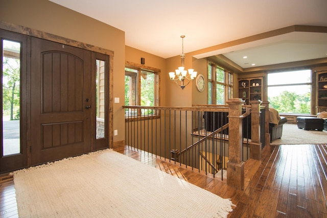 8271 Barton Ave NW, Buffalo, MN 55313 - foyer entrance with a chandelier, dark wood-type flooring, and plenty of natural light
