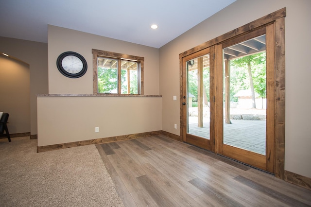 8271 Barton Ave NW, Buffalo, MN 55313 - doorway to outside with wood finished floors and recessed lighting