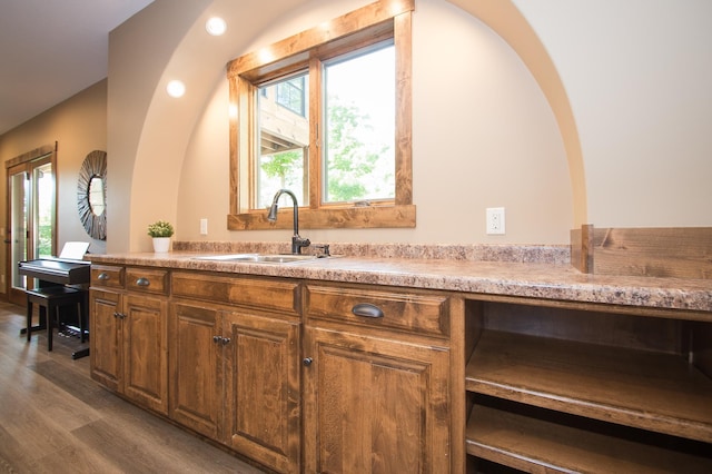 8271 Barton Ave NW, Buffalo, MN 55313 - kitchen featuring dark wood-type flooring, light countertops, brown cabinets, and recessed lighting