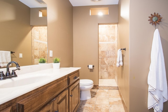 8271 Barton Ave NW, Buffalo, MN 55313 - bathroom with vanity, a tile shower, and stone finish floors