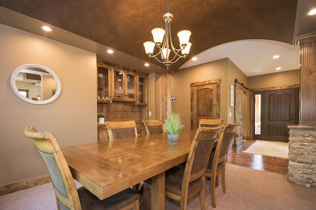 8271 Barton Ave NW, Buffalo, MN 55313 - dining room featuring recessed lighting, a chandelier, wood finished floors, and arched walkways
