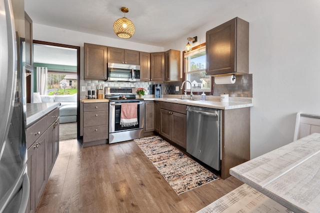 632 Quince St, Duluth, MN 55811 - kitchen with appliances with stainless steel finishes, tasteful backsplash, and healthy amount of natural light
