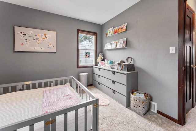 632 Quince St, Duluth, MN 55811 - carpeted bedroom with a crib and baseboards