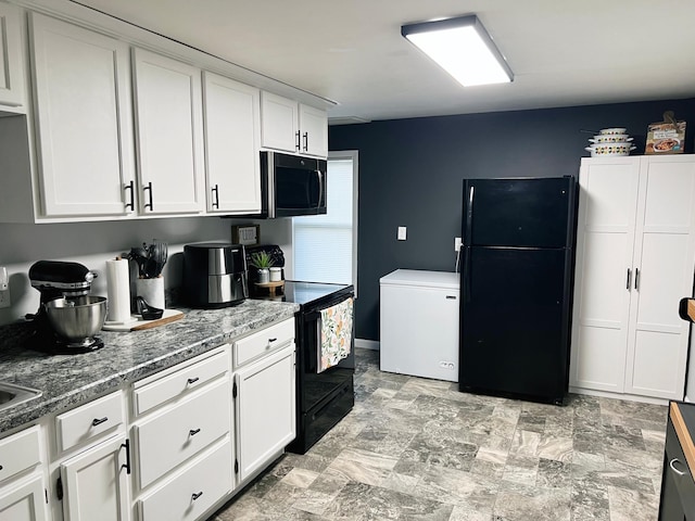 330 10th Ave, Granite Falls, MN 56241 - kitchen with black appliances and white cabinetry