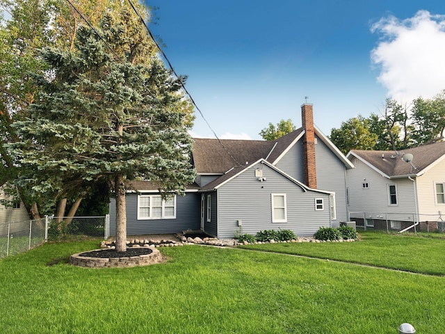 330 10th Ave, Granite Falls, MN 56241 - rear view of house with a chimney and a shingled roof