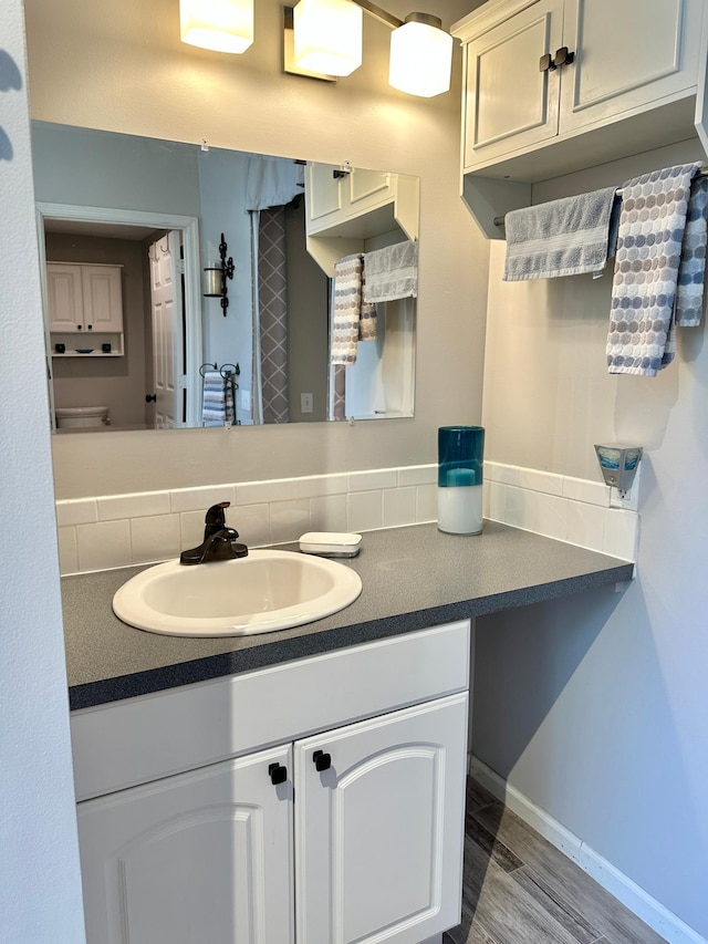 7495 Hillsdale Loop NW, Walker, MN 56484 - bathroom featuring vanity and decorative backsplash