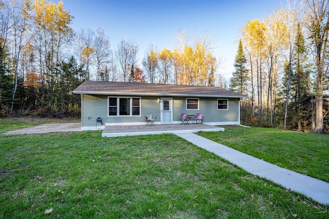 185 Olson Rd, Thomson Twp, MN 55733 - ranch-style house featuring a front yard and a patio area