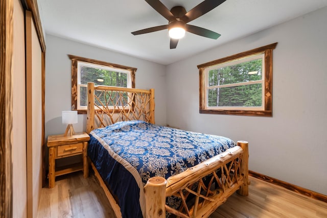 185 Olson Rd, Thomson Twp, MN 55733 - bedroom with light wood-style floors and ceiling fan