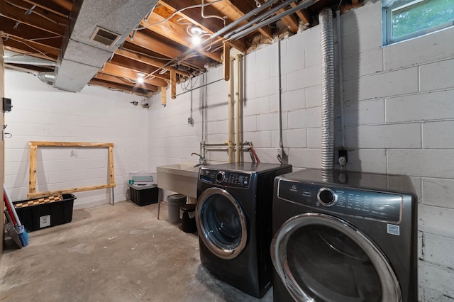 185 Olson Rd, Thomson Twp, MN 55733 - laundry area with separate washer and dryer and concrete block wall