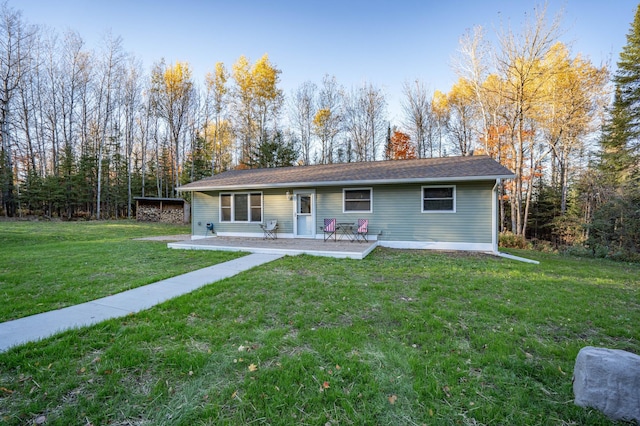 185 Olson Rd, Thomson Twp, MN 55733 - single story home with a front lawn and a patio area