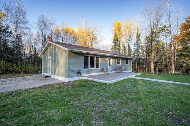 185 Olson Rd, Thomson Twp, MN 55733 - ranch-style home featuring a patio area and a front yard