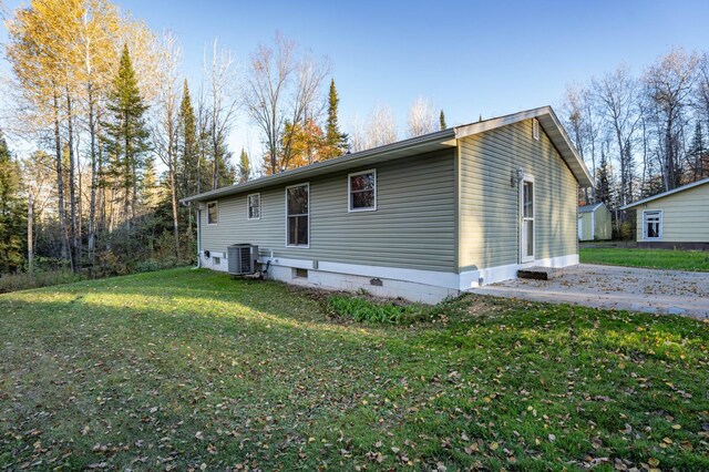 185 Olson Rd, Thomson Twp, MN 55733 - rear view of house featuring a yard