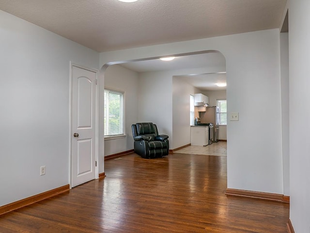 4021 Colfax Ave N, Minneapolis, MN 55412 - unfurnished room with arched walkways and light wood-style floors