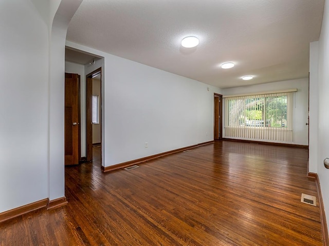4021 Colfax Ave N, Minneapolis, MN 55412 - unfurnished room featuring arched walkways and wood finished floors