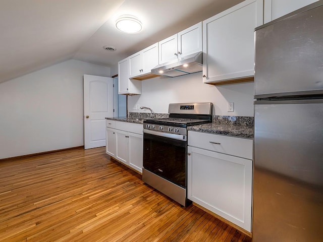 4021 Colfax Ave N, Minneapolis, MN 55412 - kitchen featuring stainless steel appliances, under cabinet range hood, lofted ceiling, light wood-style flooring, and white cabinets