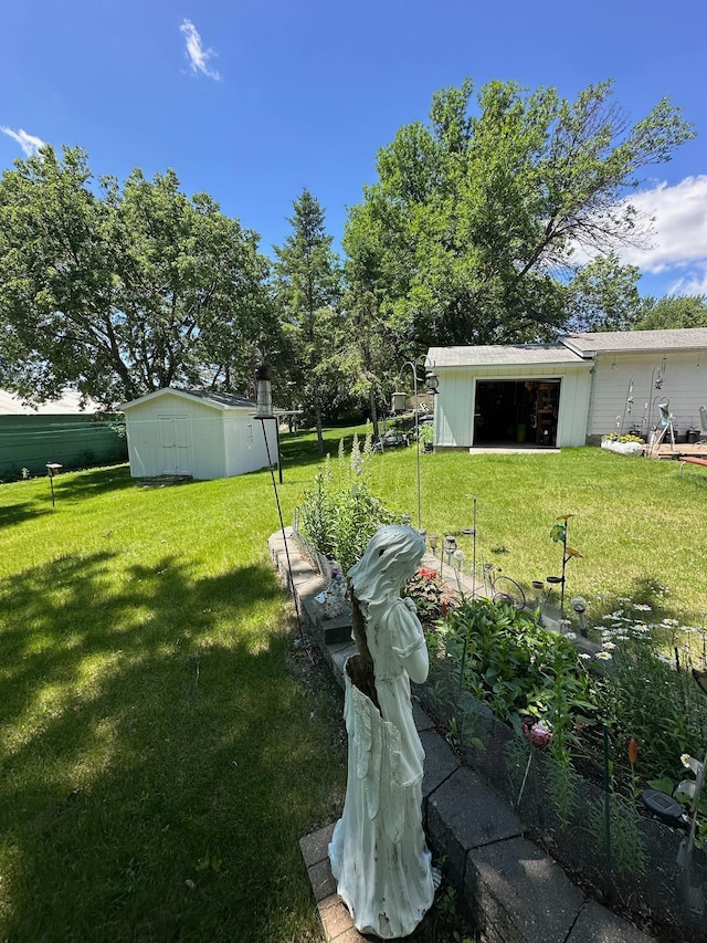 925 Willow St W, Detroit Lakes, MN 56501 - view of green lawn with an outbuilding and a garden