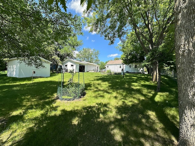 925 Willow St W, Detroit Lakes, MN 56501 - view of grassy yard with an outbuilding