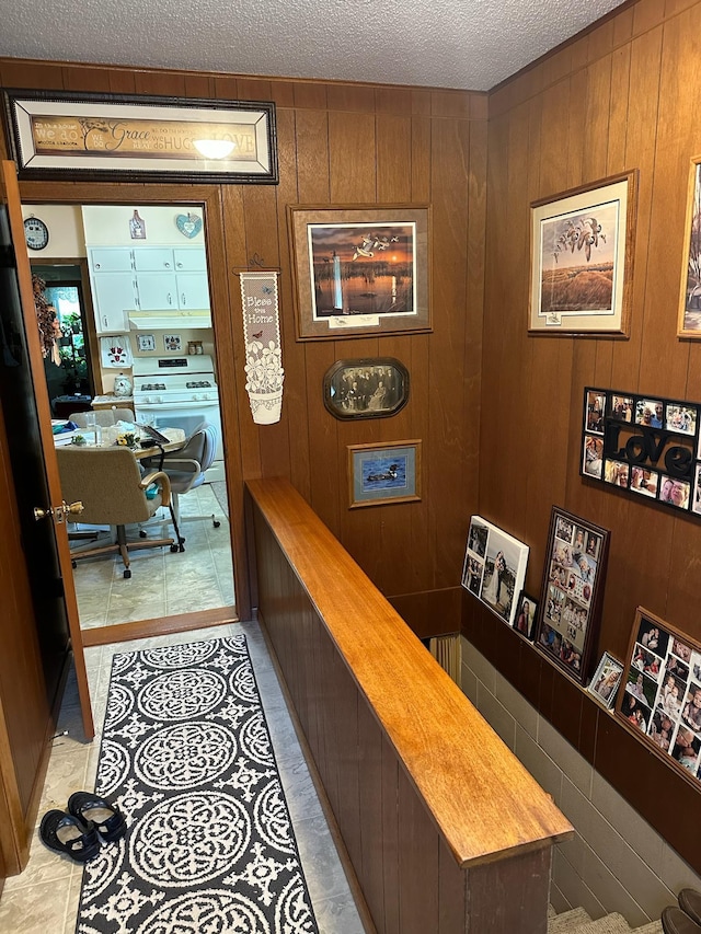 925 Willow St W, Detroit Lakes, MN 56501 - corridor with a textured ceiling and wooden walls
