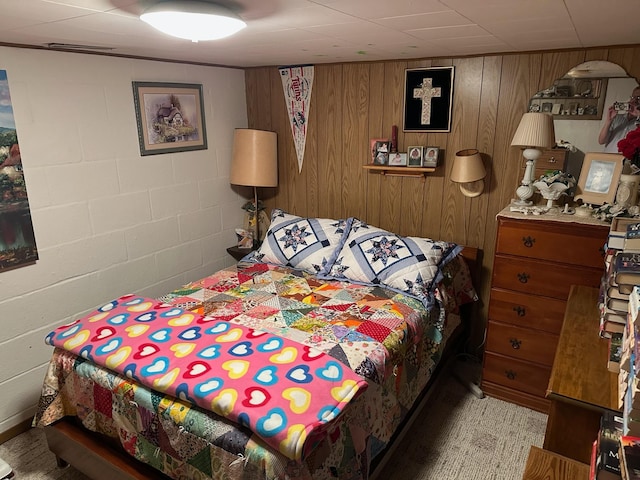 925 Willow St W, Detroit Lakes, MN 56501 - bedroom featuring concrete block wall and wooden walls