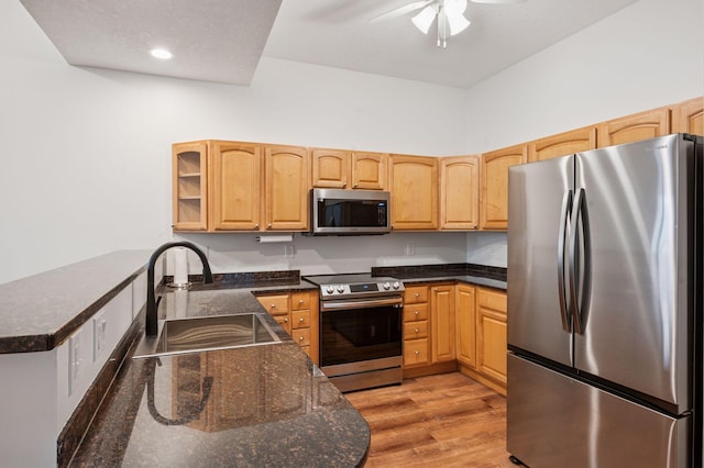 30 Main St S Unit 5E, Pine City, MN 55063 - kitchen with stainless steel appliances, light wood-type flooring, a ceiling fan, glass insert cabinets, and light brown cabinets