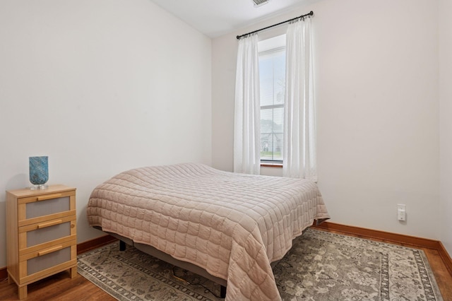 30 Main St S Unit 5E, Pine City, MN 55063 - bedroom featuring multiple windows and wood finished floors