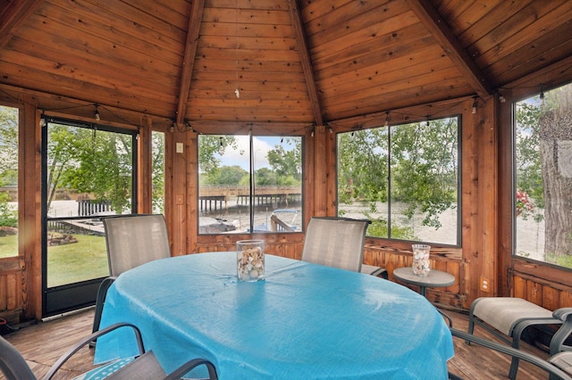 30 Main St S Unit 5E, Pine City, MN 55063 - sunroom / solarium with wood finished floors, healthy amount of natural light, wood ceiling, outdoor dining area, and wooden walls