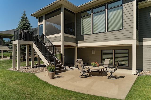 1062 Fox Hill Ln SW, Rochester, MN 55902 - view of patio featuring a sunroom and stairs