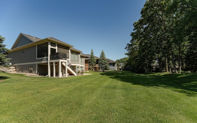 1062 Fox Hill Ln SW, Rochester, MN 55902 - view of green lawn featuring a sunroom and stairway