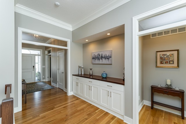 1062 Fox Hill Ln SW, Rochester, MN 55902 - hall featuring ornamental molding and light wood-type flooring
