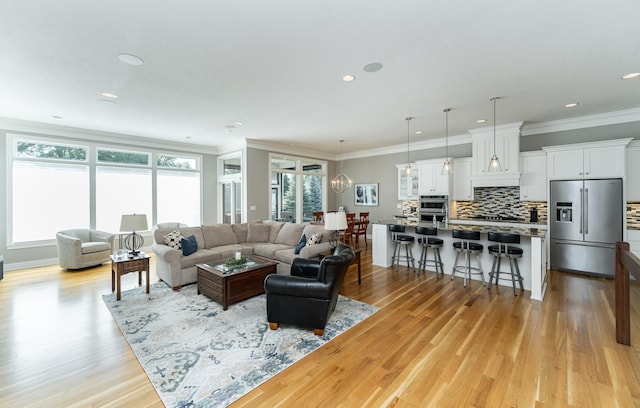 1062 Fox Hill Ln SW, Rochester, MN 55902 - living area with light wood-type flooring, crown molding, and recessed lighting