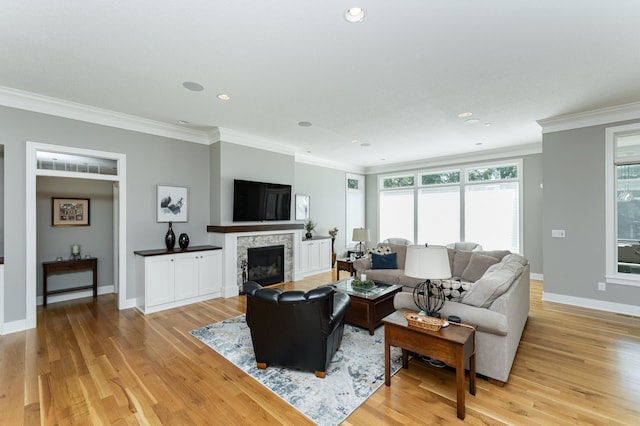 1062 Fox Hill Ln SW, Rochester, MN 55902 - living area featuring crown molding, a fireplace, light wood-type flooring, and recessed lighting