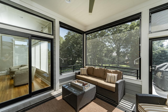 1062 Fox Hill Ln SW, Rochester, MN 55902 - sunroom / solarium featuring outdoor lounge area and a ceiling fan