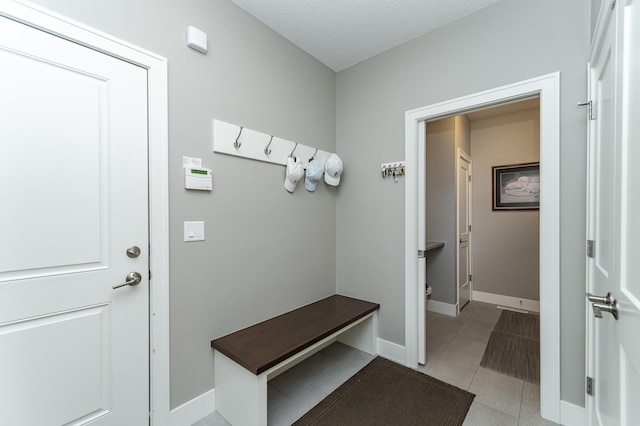 1062 Fox Hill Ln SW, Rochester, MN 55902 - mudroom with baseboards and light tile patterned floors