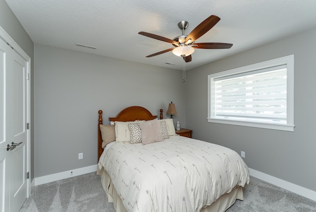 1062 Fox Hill Ln SW, Rochester, MN 55902 - bedroom featuring light carpet and a ceiling fan