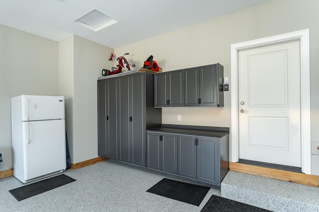 1062 Fox Hill Ln SW, Rochester, MN 55902 - kitchen with freestanding refrigerator and dark countertops