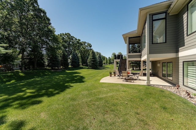 1062 Fox Hill Ln SW, Rochester, MN 55902 - view of green lawn with a patio area and stairs
