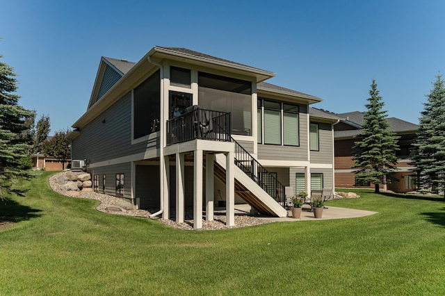 1062 Fox Hill Ln SW, Rochester, MN 55902 - rear view of property featuring stairway, a sunroom, a yard, and a shingled roof